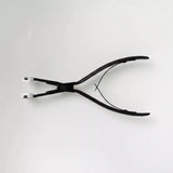 plier black stainless steel flat surface